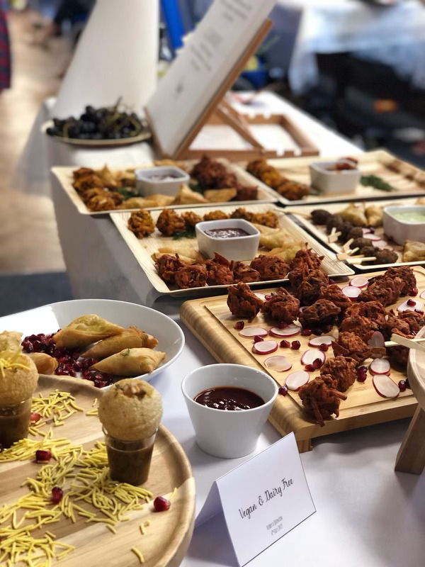 Vegan and dairy-free Indian canapé selection styled on wooden boards
