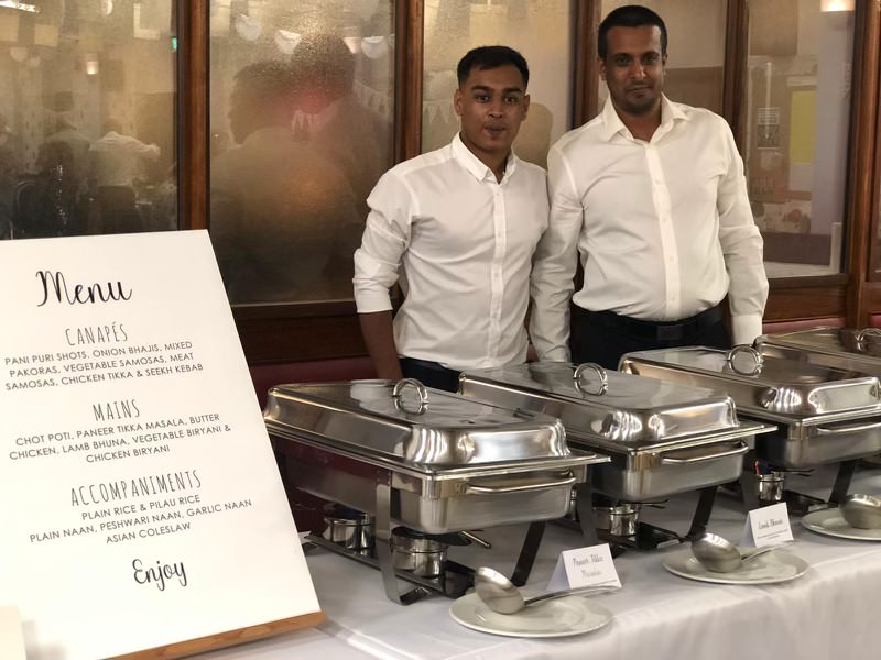 Jaflong uniformed service team ready behind a fully set corporate buffet